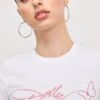 GOOD AMERICAN DOLLY SIGNATURE SUPER STRETCH BABY TEE | WHITE001 1 GOOD AMERICAN DOLLY SIGNATURE SUPER STRETCH BABY TEE | WHITE001 -GOOD AMERICAN STORE M 250307 13 GT0681STDP W001 A 0081